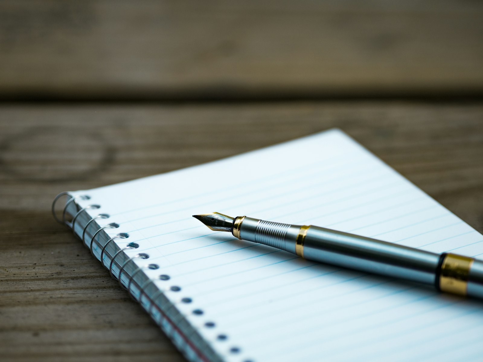 A fountain pen resting on notarization paperwork